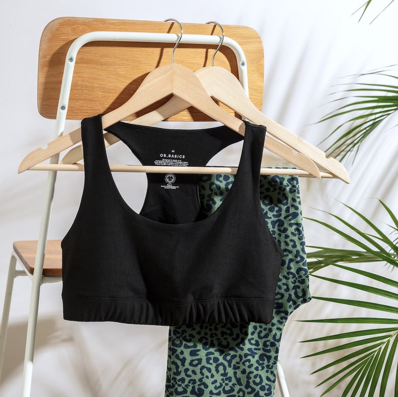 Black sports bra styled with leopard‑print leggings