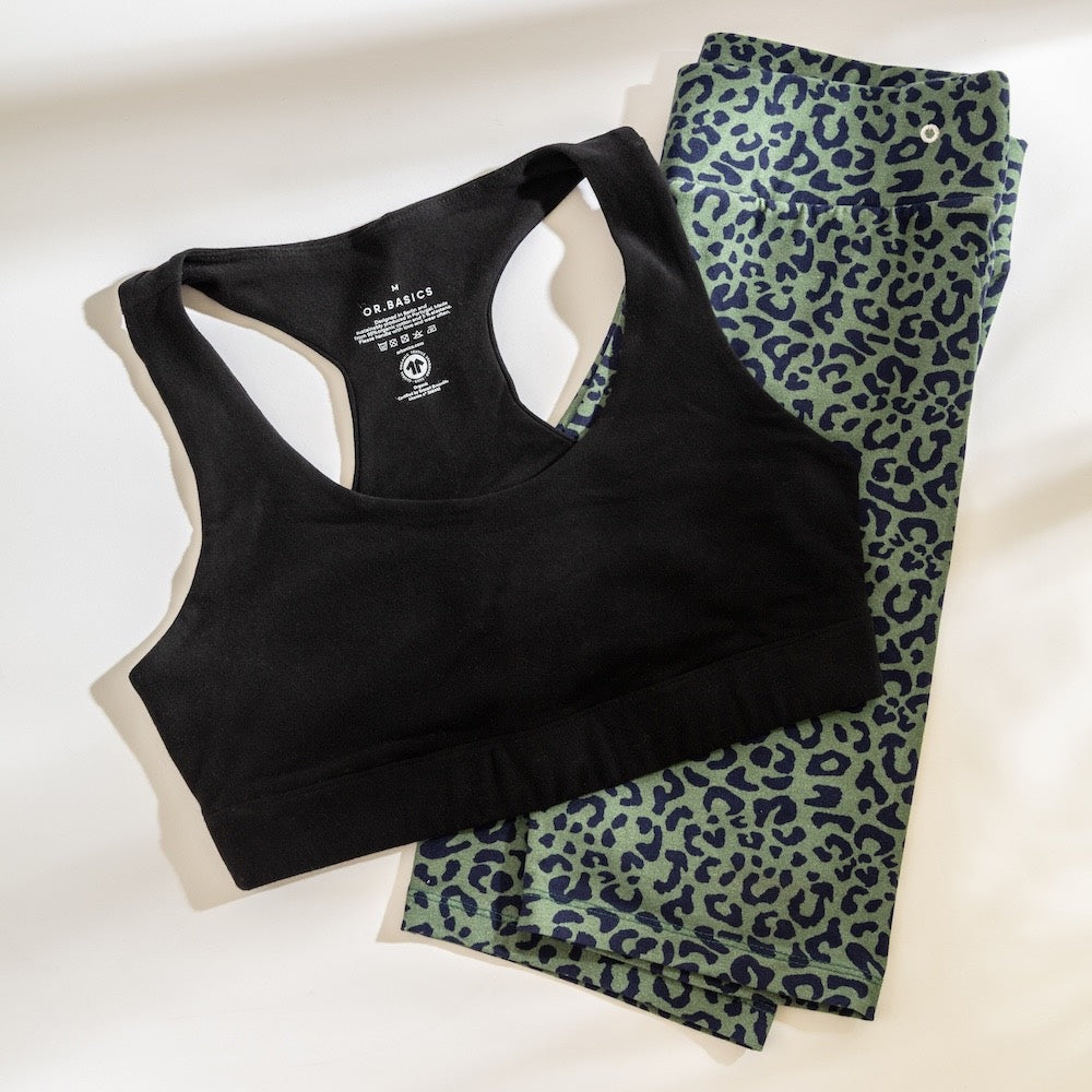 Black sports bra styled with leopard‑print leggings