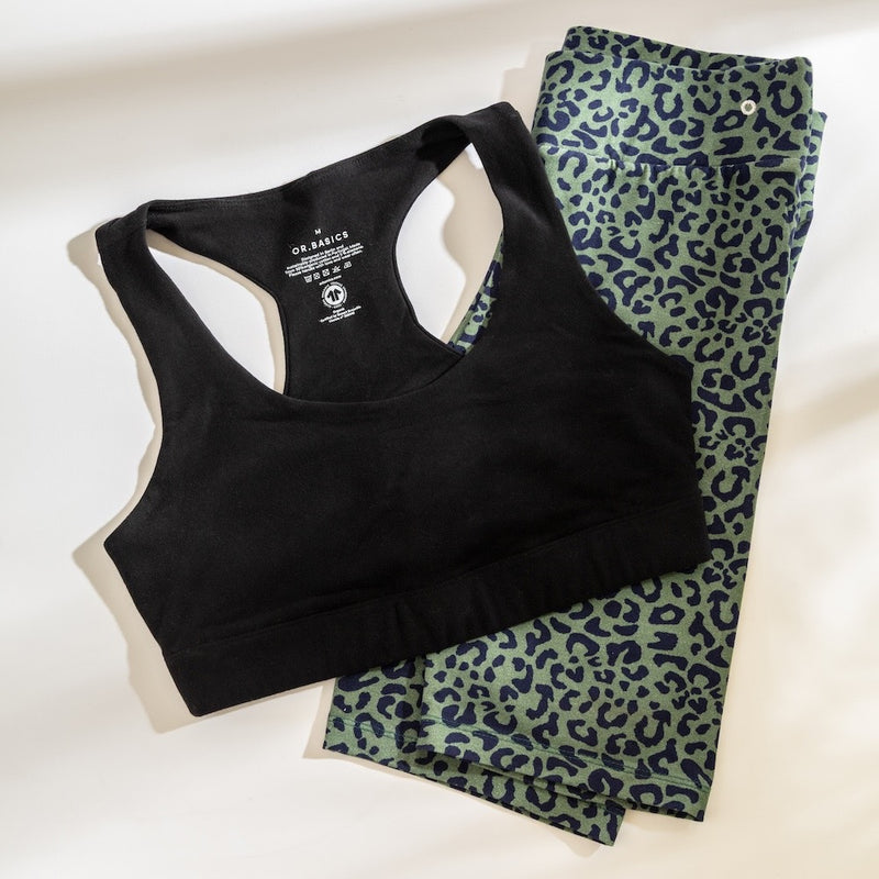 Black sports bra styled with leopard‑print leggings